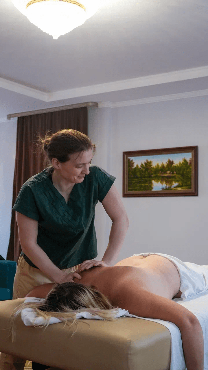 Massage is being administered to a person's back.